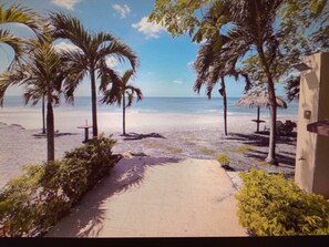 On the beach, sun loungers, beach towels