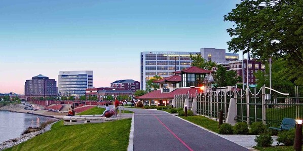 A riverside walkway with a red path, a gazebo, and a fence. - Color Pop Casa | 2BR/1BA Townhome near Ford Center (Evansville)