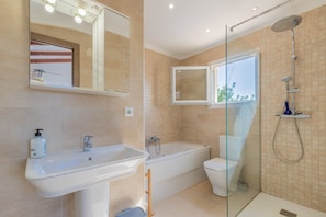 Bathtub, hair dryer, towels