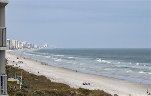 A beach with a clear view of the ocean and a city skyline in the background. - 7402 Towers 8 and 9 - 2/2 Oceanfront Beauty on Traffic Free Beach - Ponce Inlet (Ponce Inlet)