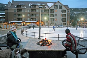Guests can enjoy the hotel's outdoor seating area with a fire pit table.