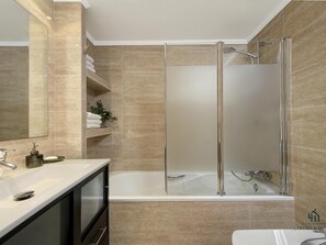 Bathtub, hair dryer, towels