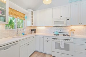 Fridge, microwave, oven, stovetop - Charming cottage with heated pool, tropical landscaping in prime location. (Anna Maria)