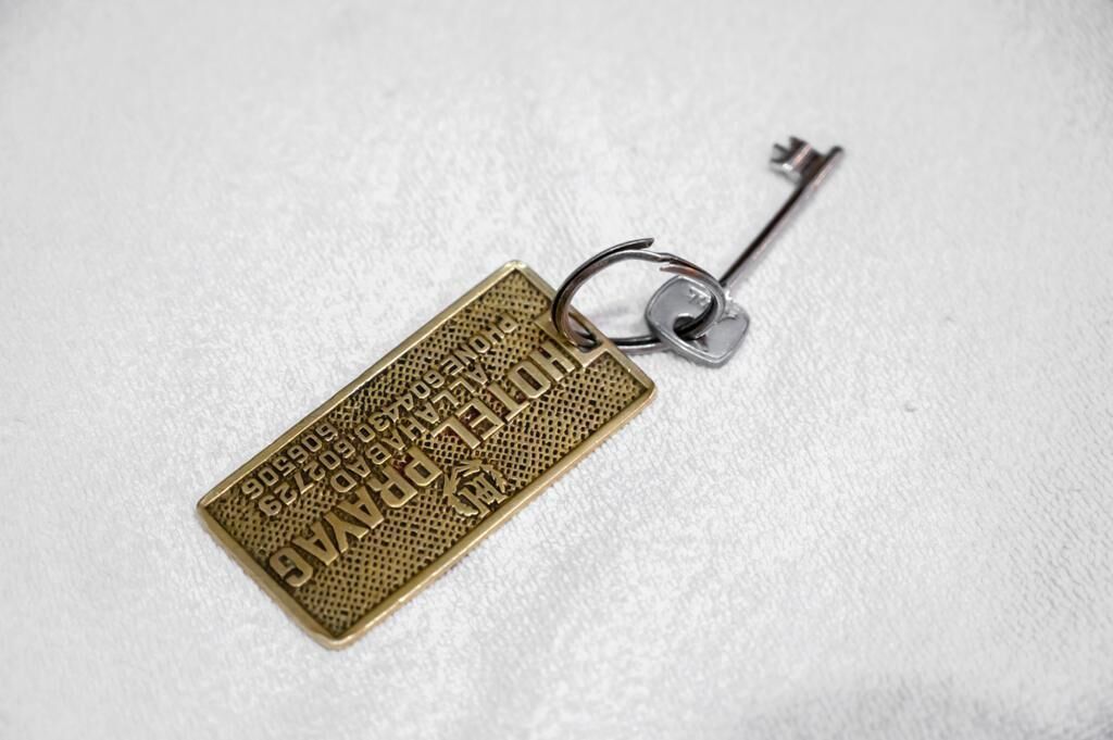 A keychain with a metal key attached to it.