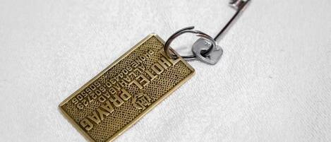A keychain with a metal key attached to it.