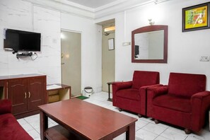 Deluxe Room, 1 Bedroom | Living area | 32-inch flat-screen TV with satellite channels, TV - Hotel Prayag (Prayagraj)
