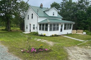 Welcome to this charming home with a covered front porch and beautifully manicured lawn.