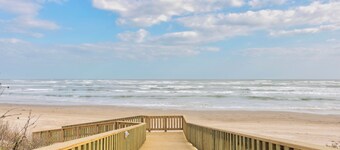 Poolside condo with covered patio, and direct pedestrian boardwalk to the beach!