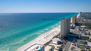 An aerial view of a coastal city with a beach, a pier, and high-rise buildings. - 2 Complimentary Beach Chairs! Aqua 1404 Luxury + Oceanfront/Sleeps 8 + Clean (Panama City Beach)