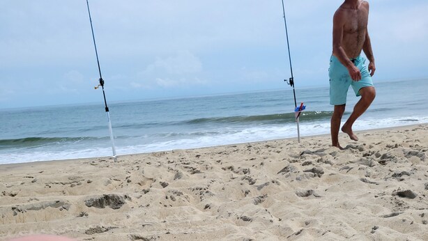 A sandy beach with footprints and two fishing rods. - 15 minutes from Base (Pemberton)