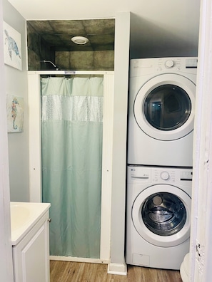 Combined shower/bathtub, hair dryer, towels, soap