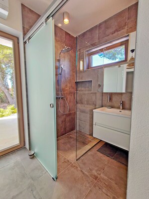 Shower, hair dryer, towels, soap