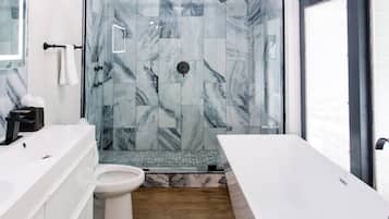 Combined shower/bathtub, hair dryer, towels, soap