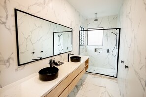 Bathtub, hair dryer, towels, toilet paper