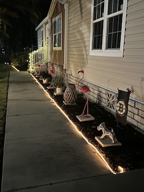 Traditional home with a well-maintained front yard and inviting entrance.