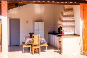 Enjoy cooking and dining in this cozy kitchen with an oven and refrigerator.