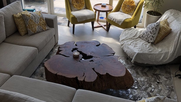 A modern living room with a view of a pool and golf course. - Beautiful Golf Course Views - Relax! (Nuevo Vallarta)