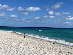 On the beach, sun loungers, beach towels