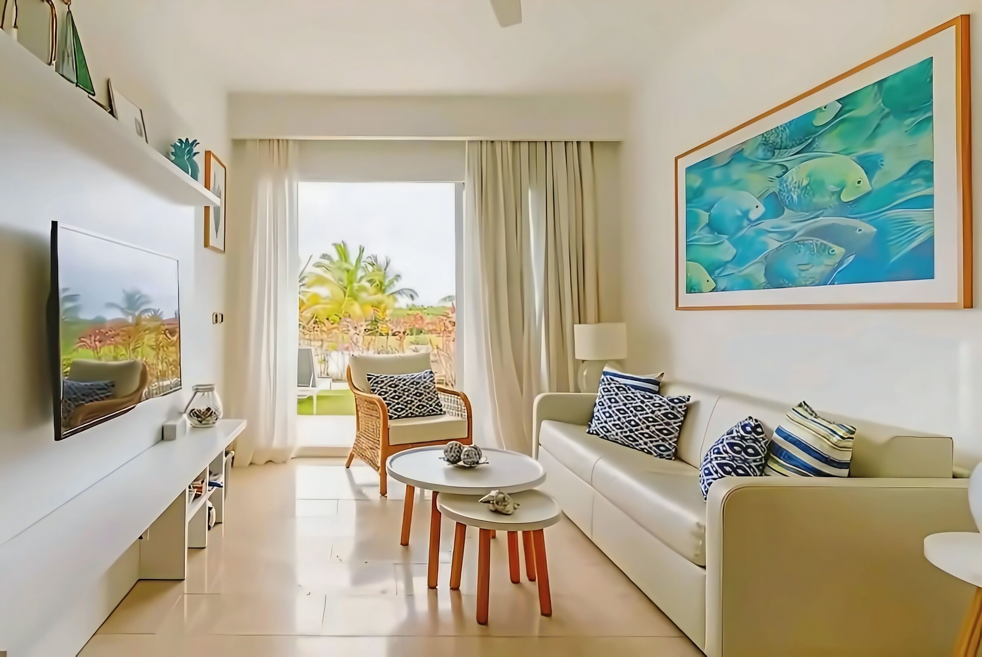 A modern living room with a sofa, coffee table, and chairs, a TV, and a large painting.