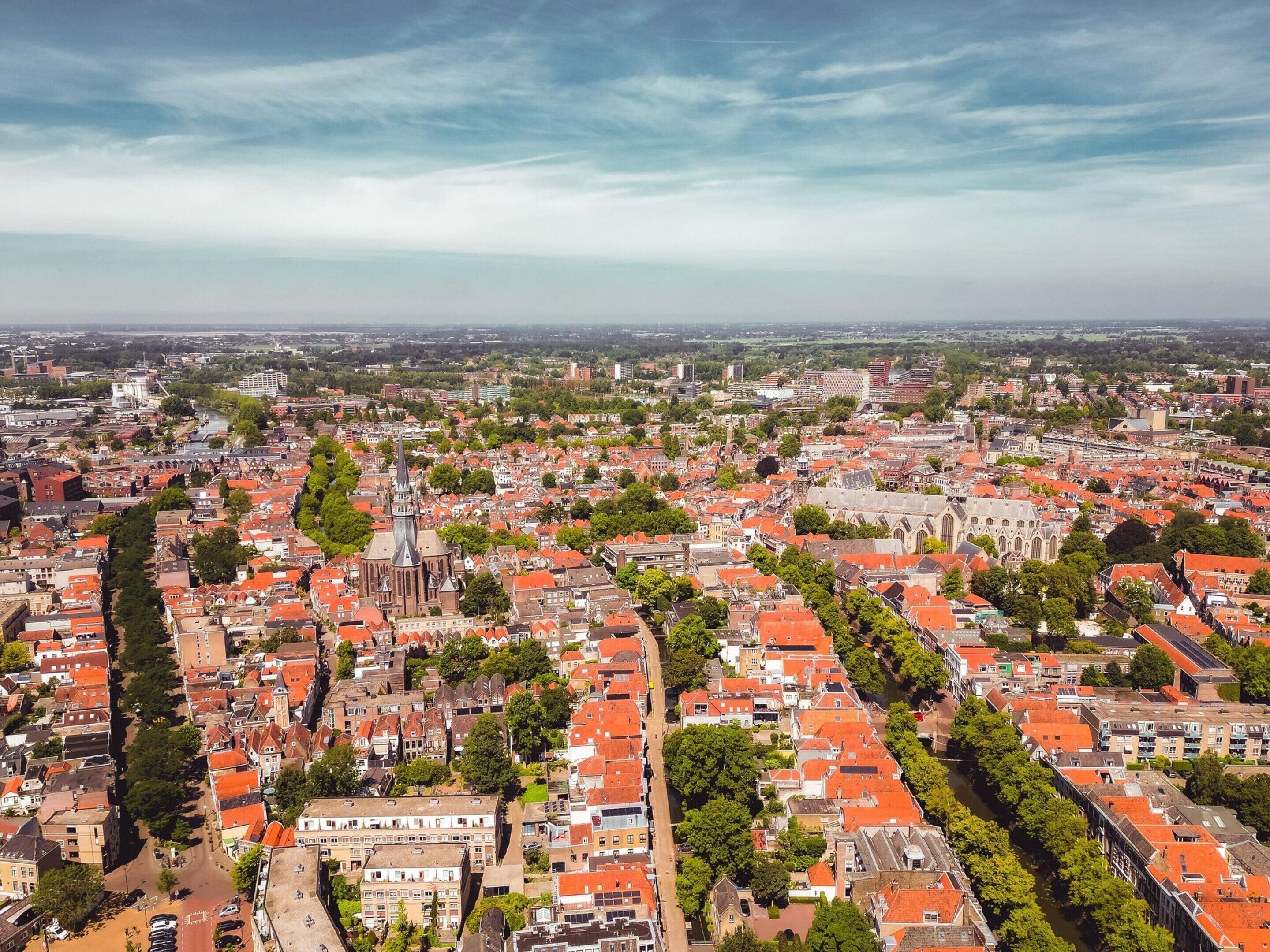 A cityscape with a prominent church and a river running through it.