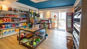 A grocery store interior with shelves stocked with snacks, beverages, and household items. - Villa in Hellevoetsluis Near North Sea Beach (Hellevoetsluis)