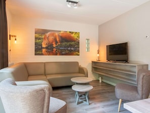 Bungalow | Living room | TV - Cozy Woodland Getaway (Oosterhout)