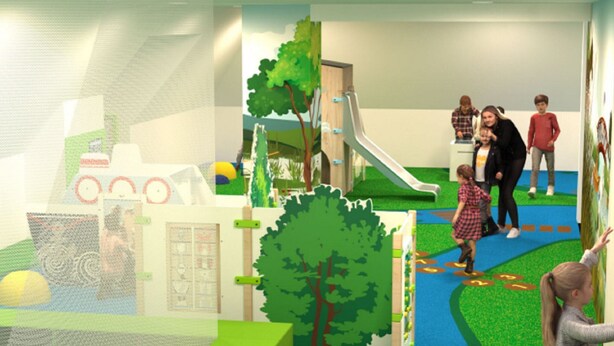 Ein Kinderspielbereich mit Rutsche, Klettergerüsten und Bällebad.