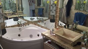 Shower, jetted tub, hair dryer, soap