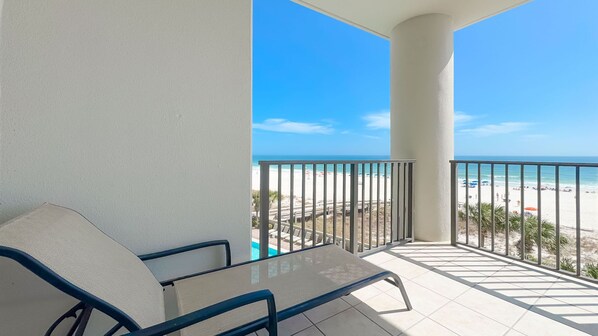 A balcony with a view of a beach and ocean. - 3rd Floor!! New Owner, New to the Rental Market, Lazy River and Slide!! (Orange Beach)