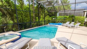 A pool area with lounge chairs and a hot tub. - Luxury 6 Bedroom Villa on Emerald Island Resort, Orlando Villa 1460 (Kissimmee)