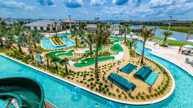 A resort with a large pool, a water slide, and a golf course. - 5 Star Villa Close to Disney, Orlando Mansion 5050 (Kissimmee)