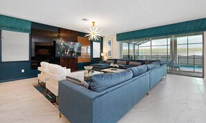 Flat-screen TV, video-game console, foosball