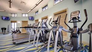 A gym with treadmills, elliptical machines, and a stationary bike. - Luxury Villa With Private Pool on Champions Gate Resort, Orlando Villa 4965 (Davenport)