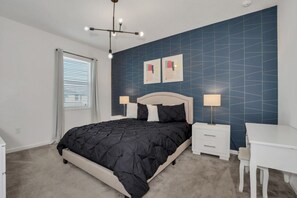 A bedroom with a bed, bedside tables, a desk, and a chair. - You Have Found the Ultimate Mansion on Sonoma Resort, Orlando Mansion 5053 (Kissimmee)