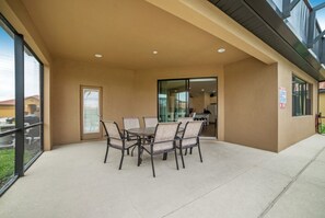 Outdoor dining - Your Beautiful 5 Star Villa Minutes From Disney on the Prestigious Providence Resort, Orlando Villa 3644 (Davenport)