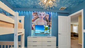 A child's room with a bunk bed, a TV on a white dresser, and a ceiling with a starry design. - Your Family Will Love the 1st Class Amenities at Your Private Villa on Windsor Island Resort, Orlando Villa 5044 (Kissimmee)