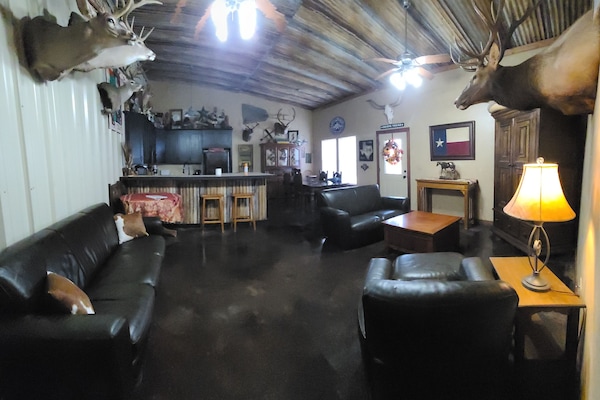 Great room, features Texas funky "Man Cave" decor. Rusty Tin ceiling.
