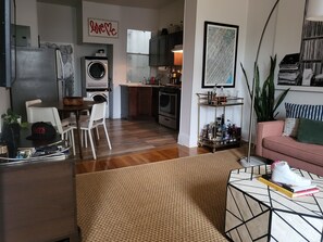 Cozy living space with a kitchen, dining area, and comfortable sofa.
