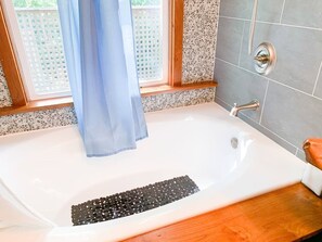 Combined shower/tub, hair dryer, towels, soap