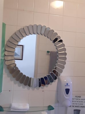 Shower, designer toiletries, hair dryer, bathrobes