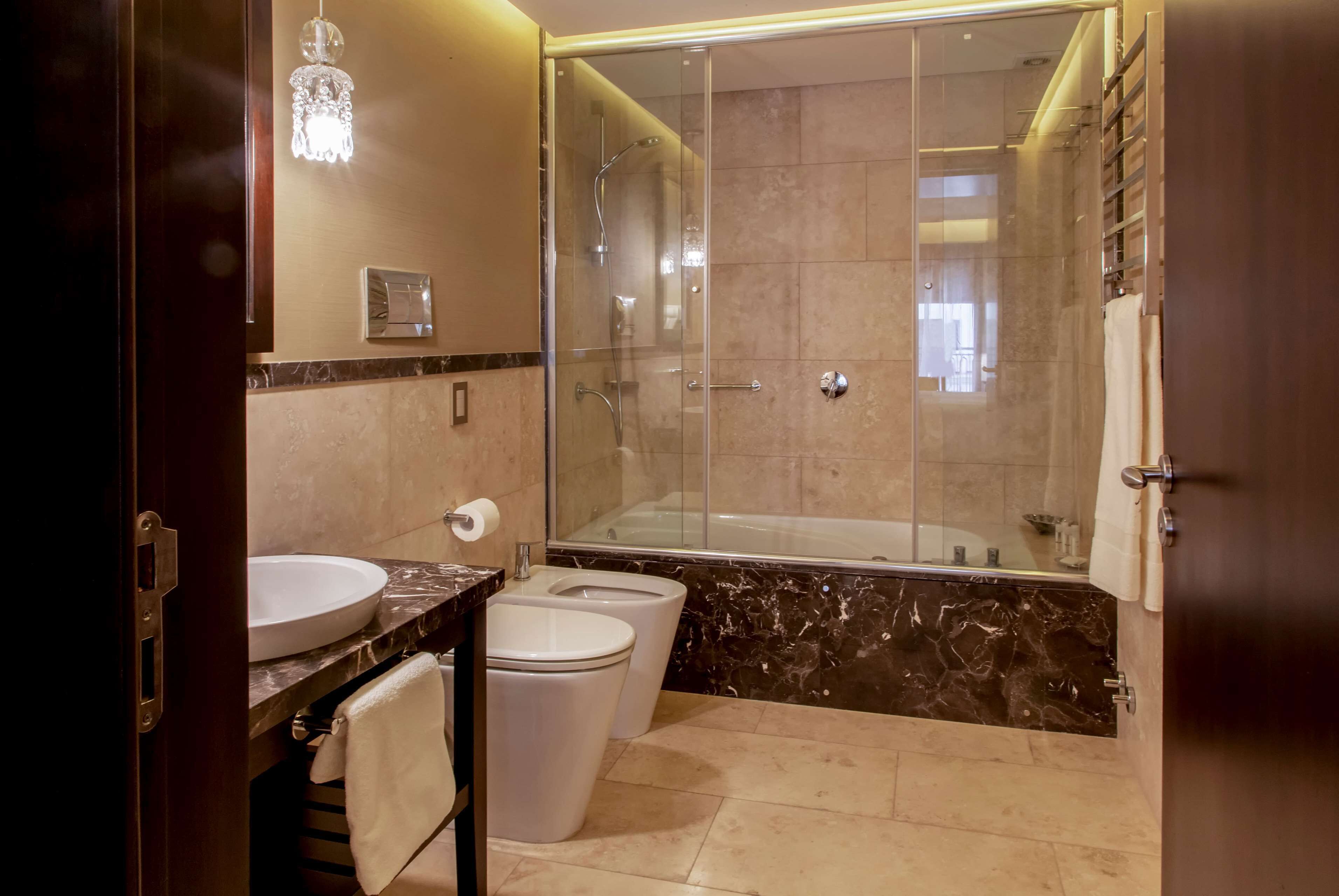 suite, 1 king bed, non smoking | bathroom | hair dryer, towels