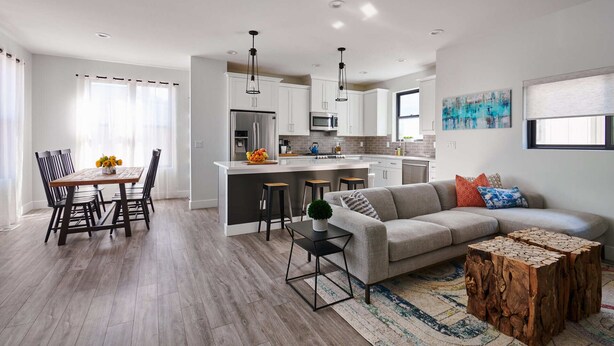 A modern kitchen with white cabinets, stainless steel appliances, and a central island. - Luxury Rowhome 🏔 Mountain Views Littleton Main St (Littleton)