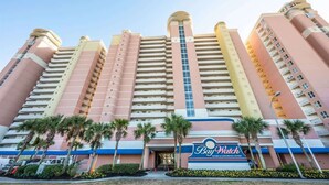 A multi-story hotel with a prominent 'BayWatch Resort & Conference Center' sign. - Bay Watch 503 Direct Oceanfront w/ Tiki Bar, Pools (North Myrtle Beach)