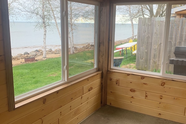 Sunroom facing the lake with windows on three sides
