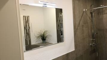 Shower, towels, soap, toilet paper