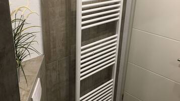 Shower, towels, soap, toilet paper