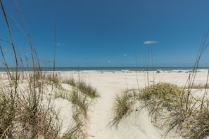 A beach with sand dunes and a clear blue sky. - Beachy Getaway–Cozy, Clean & Equipped w/ All Essentials! Relax, Enjoy & Refresh! (St. Augustine Beach)