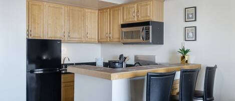 Fridge, microwave, stovetop, coffee/tea maker