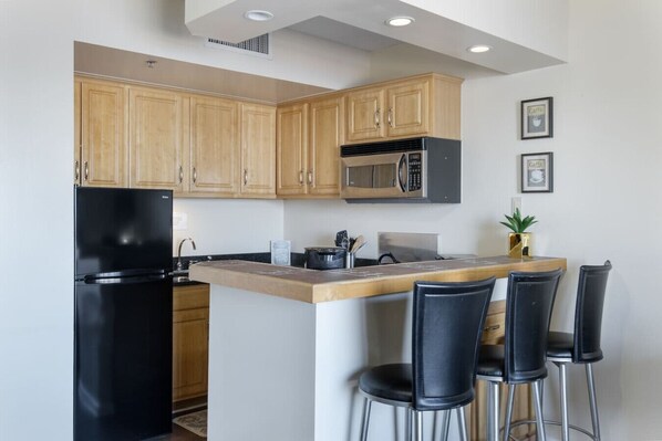 Fridge, microwave, stovetop, coffee/tea maker