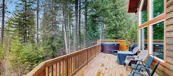 Dog-friendly mountain retreat near skiing with lake view, hot tub, & balcony